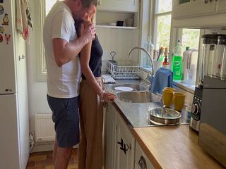 Hot housewife milf makes husband horny while doing the dishes and he fucks her from behind